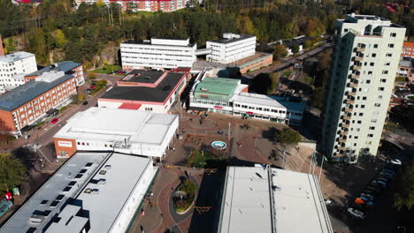 Main-square-of-Kortedala-district-in-Gothenburg-with-apartment-buildings-around,-aerial-drone-view