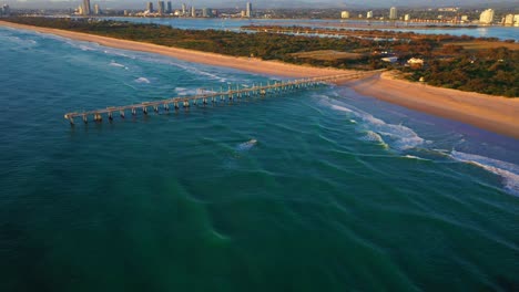 drone flying over gold coast seaway and jetty, sunrise,surf, peaceful