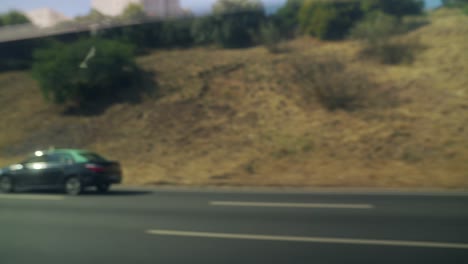 dark station wagon driving on a highway