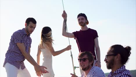 friends enjoying a party on a sailboat