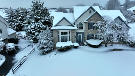 Single-family-home-in-USA,-trees-covered-in-winter-snow