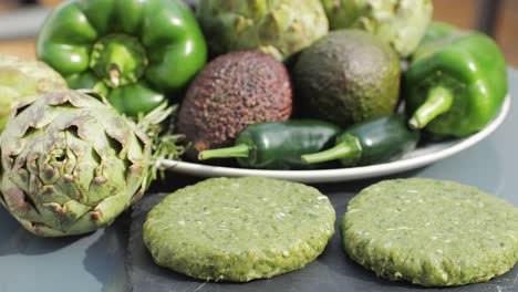 raw green vegetable patties with fresh vegetables