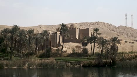 view of beautiful egyptian village from a nile river cruise