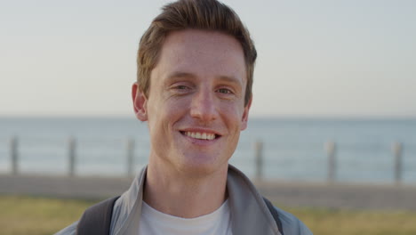 portrait confident young man student smiling flirting enjoying happy relaxed lifestyle on summer vacation seaside background