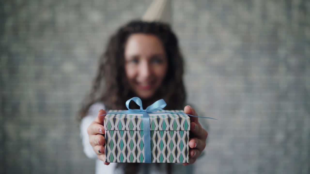 Happy Woman Holding a Birthday Gift