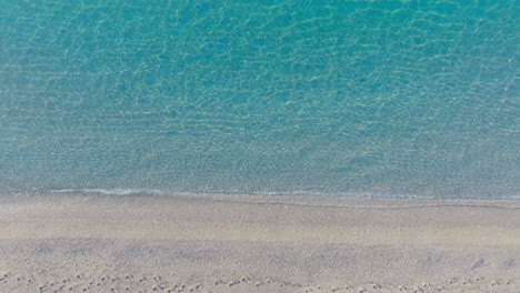 aerial view of a beautiful beach with clear turquoise water