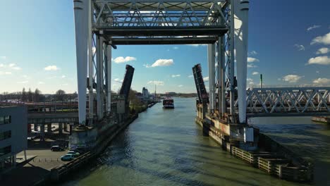 a movable bridge opening up for a vessel to cross to the other side of the river