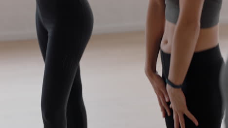 beautiful caucasian yoga woman practicing standing forward bend pose meditation stretching body preparing for healthy exercise in fitness studio