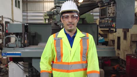 young factory worker or engineer close up portrait in factory