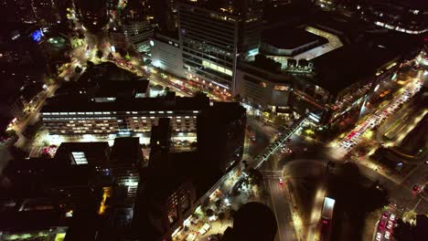 Aerial-orbit-shot-around-Los-Leones-at-night,-Las-Condes-district