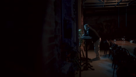 man in a dark restaurant interior