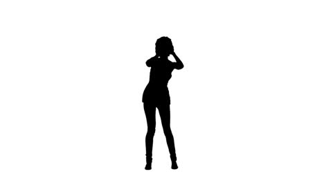 silhouette of a woman dancing and listening to music