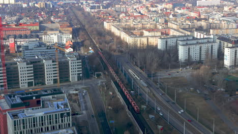 mineral wagon train and traffic seen from top of mol campus towards west in budapest, hungary