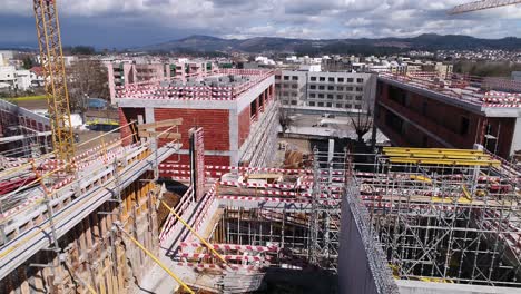 building construction with cranes aerial view