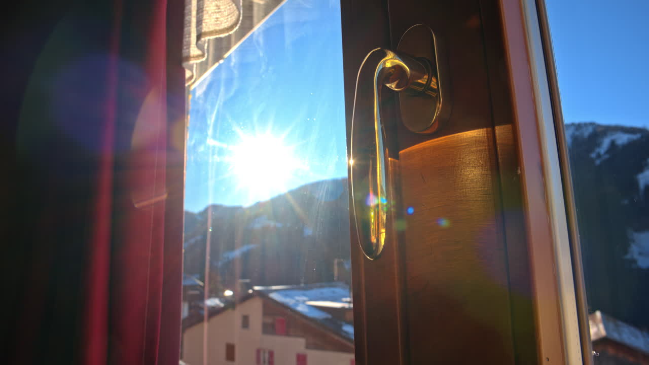 Close up of the handle of a window of a cabin in the mountains in the Dolomites, Italy