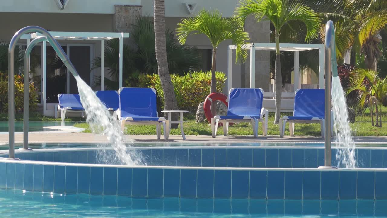 Water jet decks with strong stream of water in swimming pool in Cuba