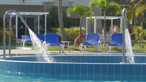 water jet decks with strong stream of water in swimming pool in cuba