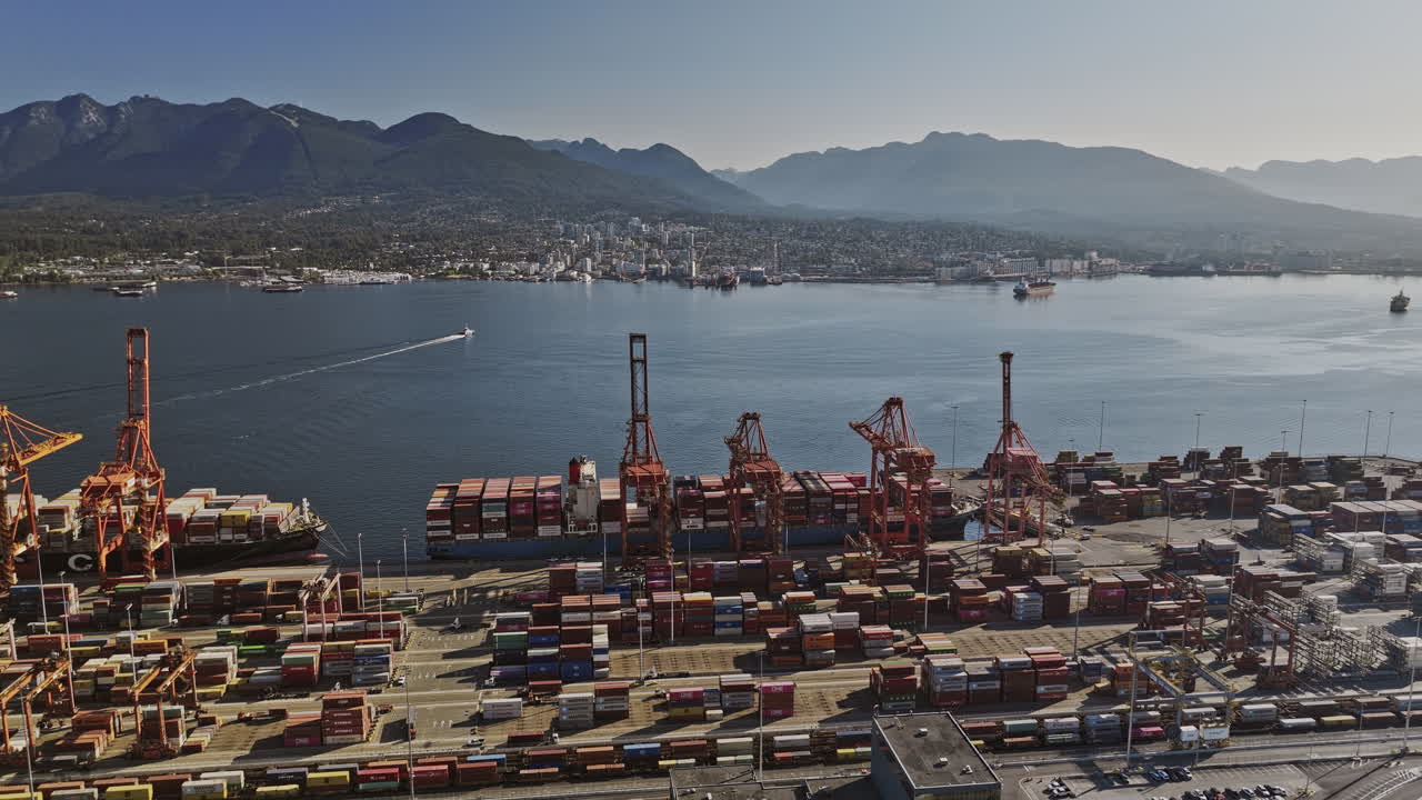 Vancouver BC Canada Aerial v89 drone flyover and around Centerm container terminal capturing shipyard operation facility, harbour and North shore mountain view - Shot with Mavic 3 Pro Cine - July 2023