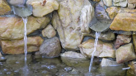 beautiful water fountain made of stone in a garden