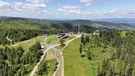 treetop walk bachledka - popular for tourists and family attraction with a view of high tatra mountains in summer in slovakia. - aerial shot