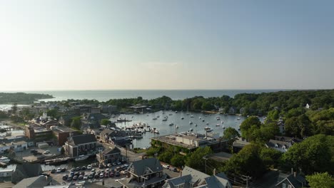 Rising drone shot of Cape Cod&#039;s protected &quot;Eel Pond&quot; harbor filled with boats