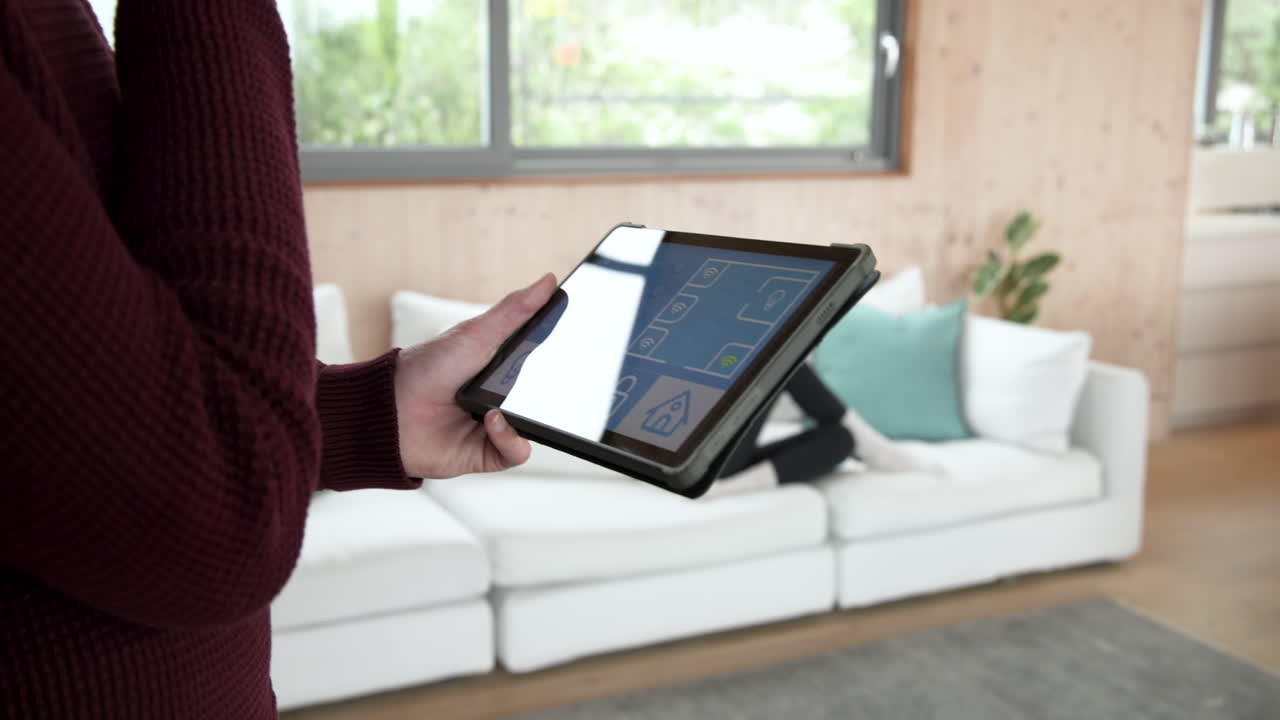 Controlling smart home devices using tablet in cozy living room