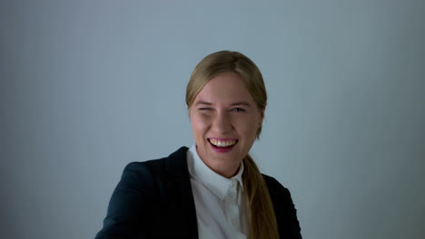 Slow-motion-shot-of-happy-girl-smiling-and-pointing-With-Finger-Toward-Camera