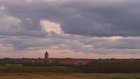 Old-lighthouse-in-the-south-west-of-the-Netherlands,-during-sunset