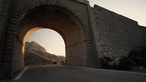 close-up of a tunnel on the famous snake-shaped road in sunny day in tramuntana mountains on the island of mallorca