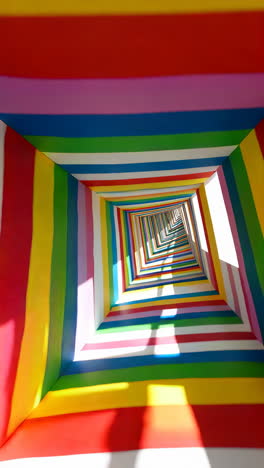 vibrant rainbow geometric tunnel with repeating squares