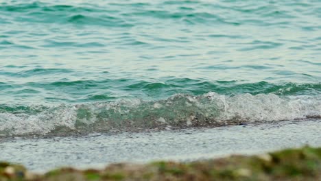 sea waves on black sand beach. slow motion