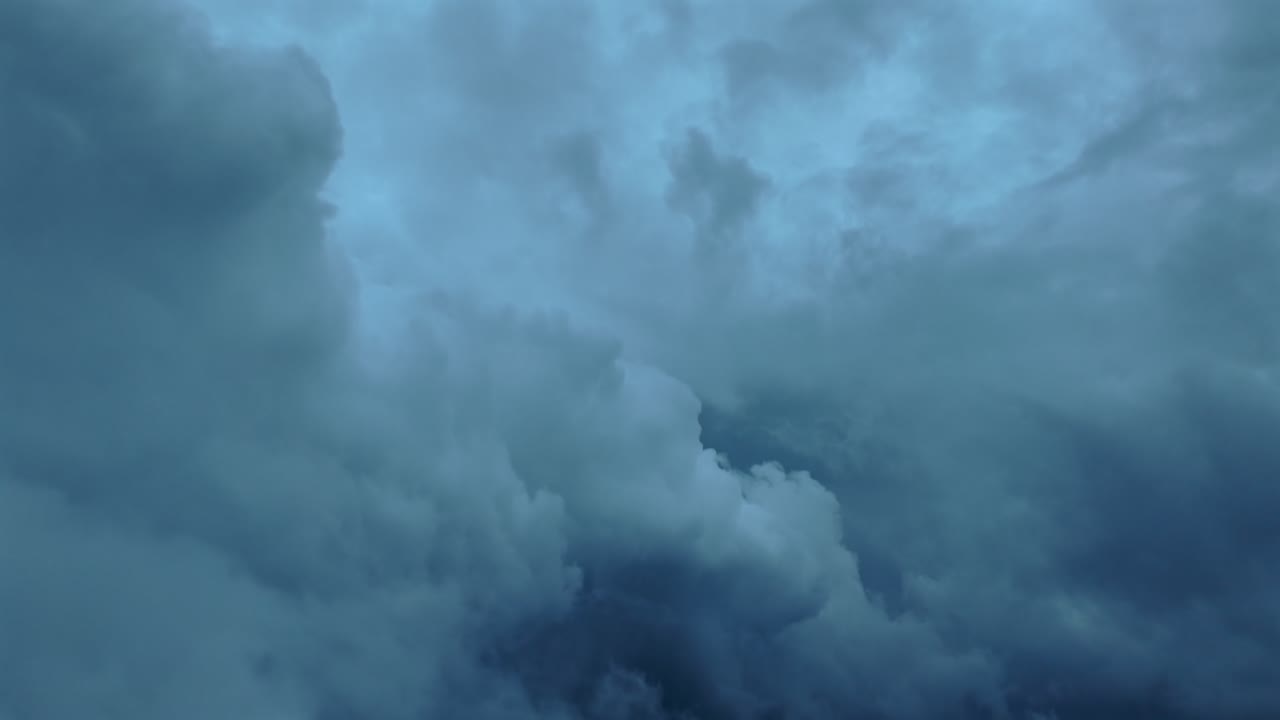 Immersive threatening experience in a flight inside storm clouds in a sinister sky full of cumulonimbus storm clouds