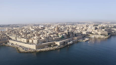 historical coastal city valletta,malta,with stone harbor walls,aerial