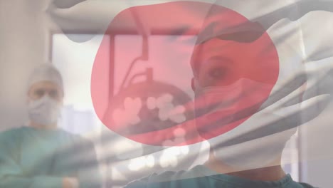 animation of flag of japan waving over surgeons in operating theatre