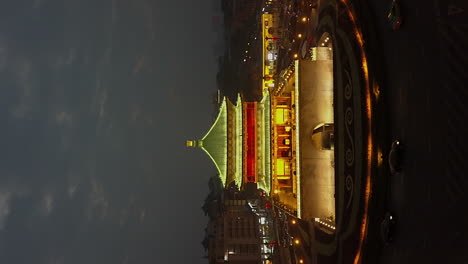 vertical format: flight to xi'an city bell tower traffic circle, china