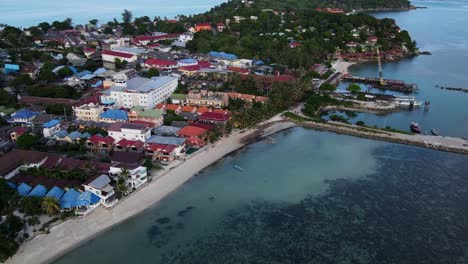 an aerial view of beachfront resorts with sea view on beautiful tropical island koh phangan