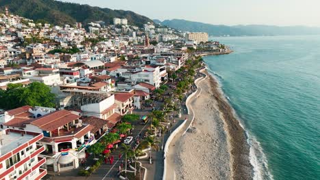 pride parade in the beautiful city of puerto vallarta mexico with its iconic church bathed by the pacific ocean
