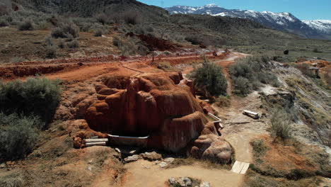 Drone-Shot-of-Mystic-Hot-Springs-in-Utah-USA,-Desert-Landscape-and-Mineral-Water