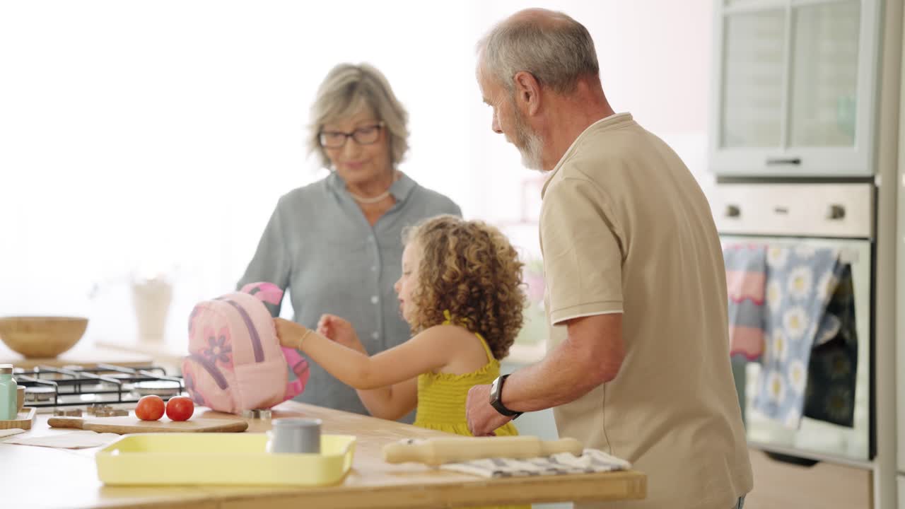 Grandparents with Grandchild in Kitchen