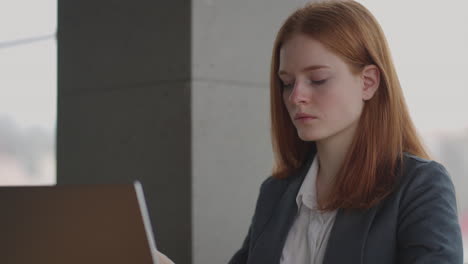 pensive-woman-lawyer-or-journalist-is-reading-bad-news-in-internet-and-thinking-working-in-office-or-coworking