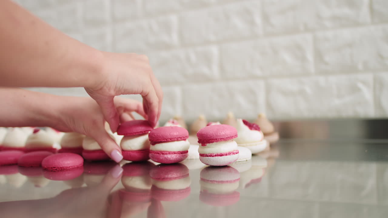 Arranging colorful macarons