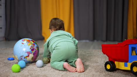 baby crawling and playing with toys