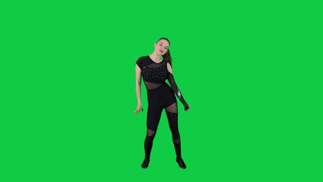 Stunning-female-dancer-performing-a-dance-in-front-of-a-green-screen-wearing-a-black-outfit-in-slow-motion