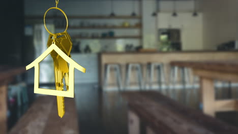 animation of hanging golden house keys against interior of a bar