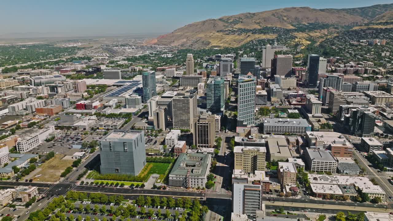 Salt Lake City Utah Skyline at Day, Mountains Behind, Aerial Drone
