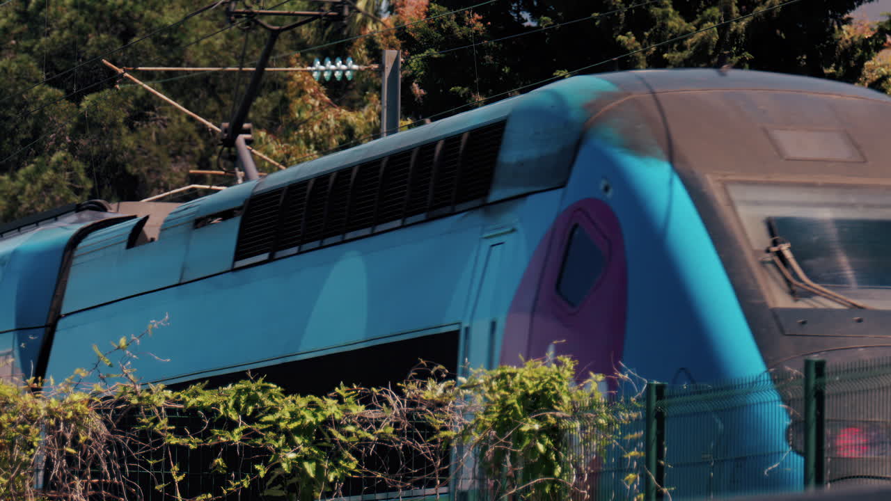 Cannes, France - June 10, 2024: Blue train driving in Cannes