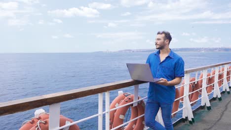 university student working with laptop on ferry in slow motion.