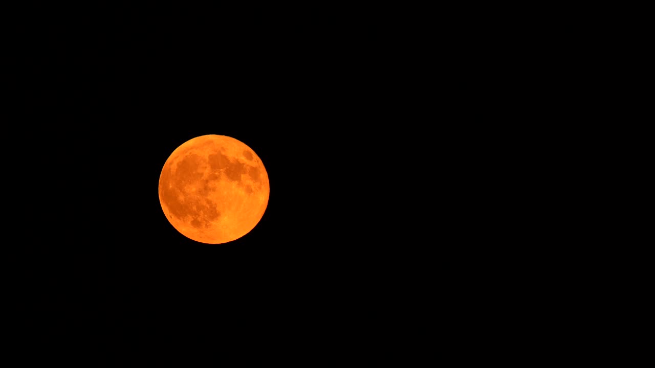 Blood moon rising in the sky