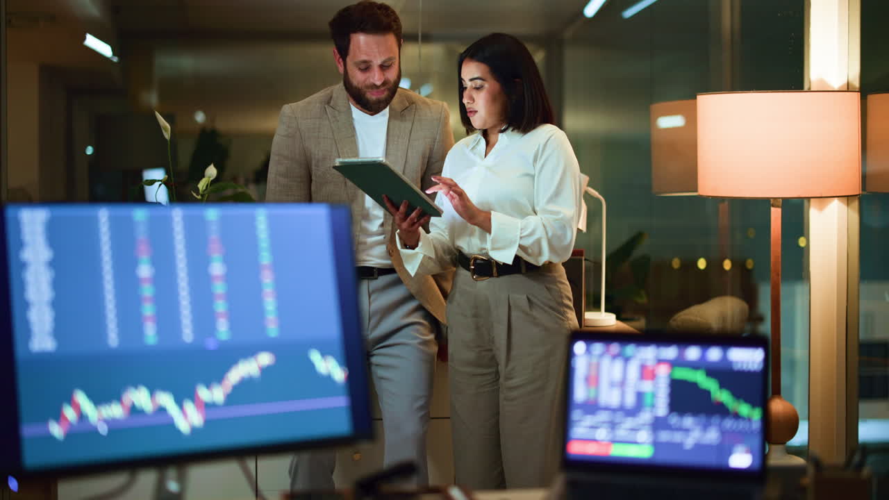 Business professionals analyzing financial data in the office