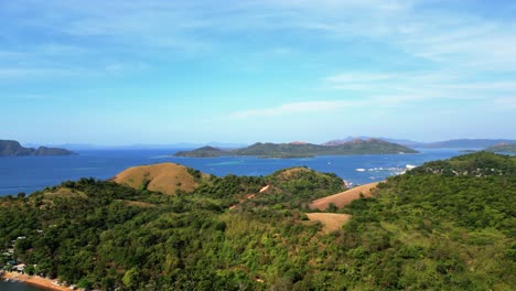 philippines coron harbor sea pan left aerial drone shot of island mountains